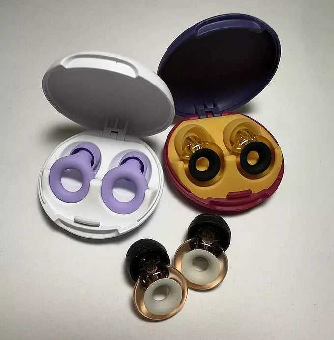 3 pairs of earplugs: Loop Quiet, Loop Engage and Loop Engage 2 Plus on a grey background