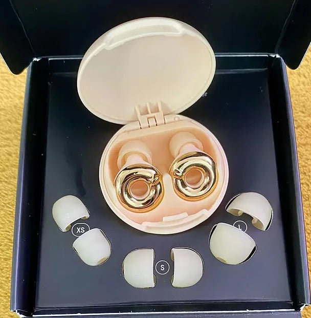 Loop Switch Gold in the case and original box next to different sizes of ear tips